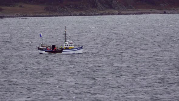 Boat Sailing in the Isle of Islay in Scotland alt