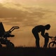 Silhouettes of Happy Mother Having Good Time with Their Little Children on Park - VideoHive Item for Sale