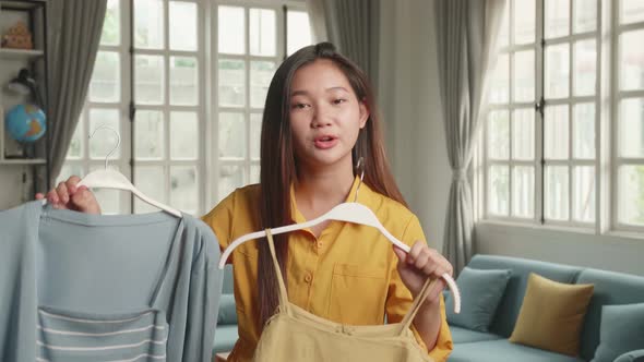 Young Girl Fashion Blogger Or Woman Showing Casual Colourful Shirts On Camera For Sell Online alt