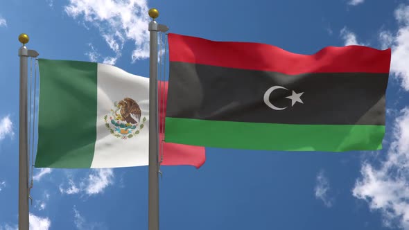 Mexico Flag Vs Libya Flag On Flagpole alt