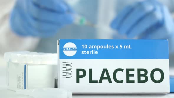 Box with Placebo Medicine on the Table alt