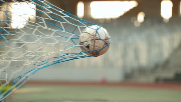 Soccer ball in the goal net, Ultra Slow Motion alt