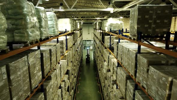 Forklift To Logistics Warehouse. Logistic Loader Pallets on Logistic Warehouse