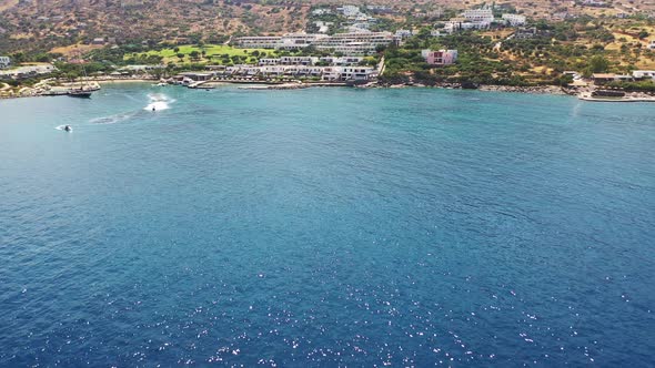 Aerial View of a Person Flyboarding in the Sea. Elounda, Crete, Greece