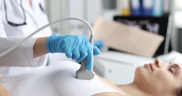 The Doctor Makes an Ultrasound of the Heart to a Sad Woman alt