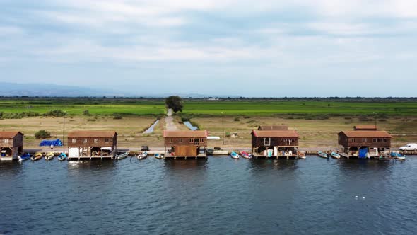 Aerial view of fishing huts at Greek national park of Axios river. alt