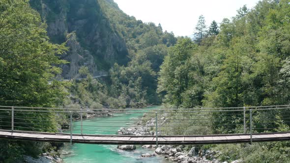 Girl on suspension bridge, Soca River, Soca Valley, Slovenia