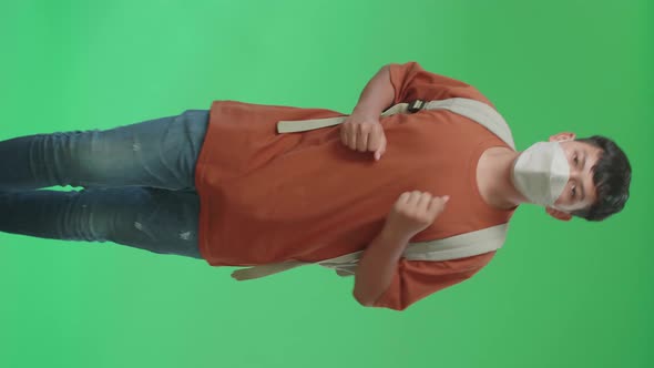 Asian Boy Student Wearing A Mask, Running To School On Green Screen Chroma Key alt