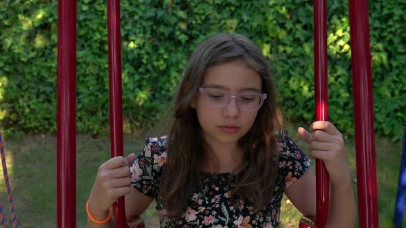 Young Girl Is On Swing 4