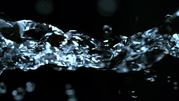 Super Slow Motion Shot of Flowing Water at 1000Fps Isolated on Black Background alt