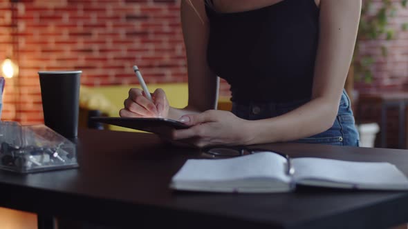 Female Fashion Designer Who Owns Digital Tablet Computer Technologies in Creative Production Studio alt