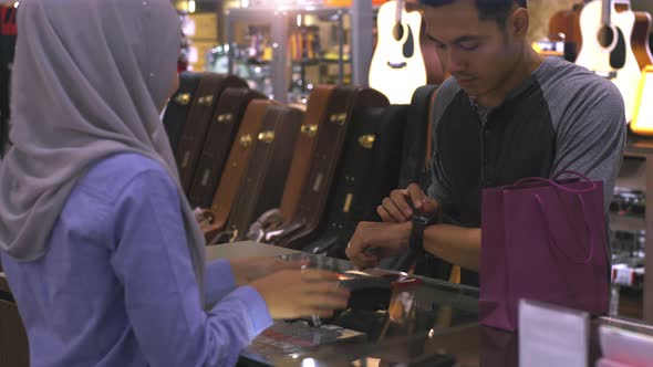 Asian Muslim Man Using smartwatch For Payment 14