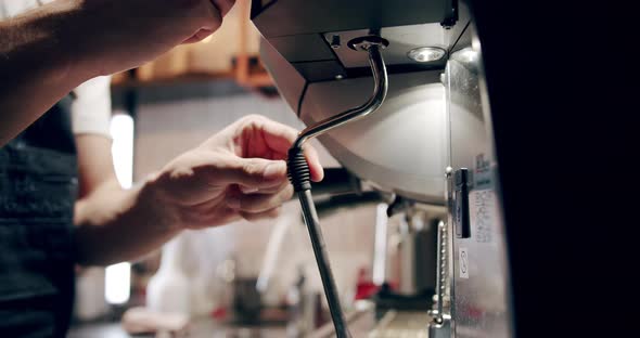 Barista at Work Making a Cup of Strong Coffee in a Modern Coffee Machine alt