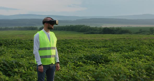 Farm Specialist Engineer Using Technology VR Monitoring Harvest Working for Agriculture Productivity alt