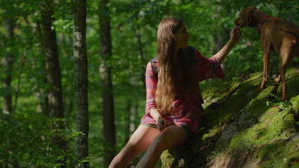 Girl training her dog alt