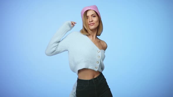 Woman in Casual Clothes Dancing on Color Background