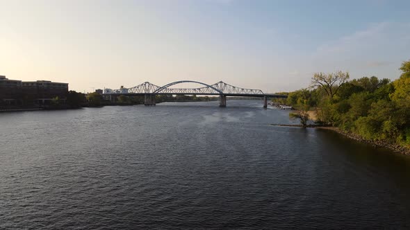 Flyover of main channel of Mississippi River at La Crosse, Wisconsin. Big blue bridge over river.