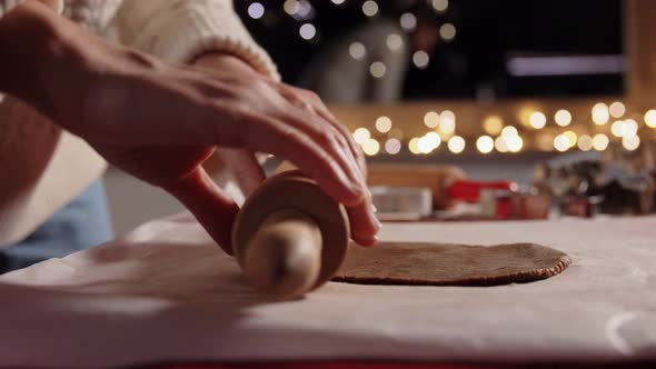 Woman with Rolling Pin Making Gingerbread at Home