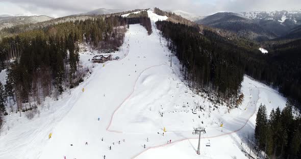 Aerial View of the Ski Resort in Mountains at Winter alt