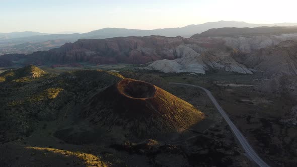 Aerial jib drone view of a dormant volcano in St. George, Utah.  Unique desert landscape. alt