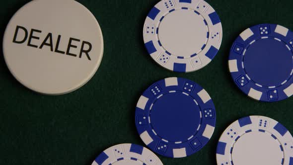 Rotating shot of poker cards and poker chips on a green felt surface - POKER 038 alt