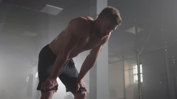 Exhausted Young Men Resting After Intensive Workout in Gym alt
