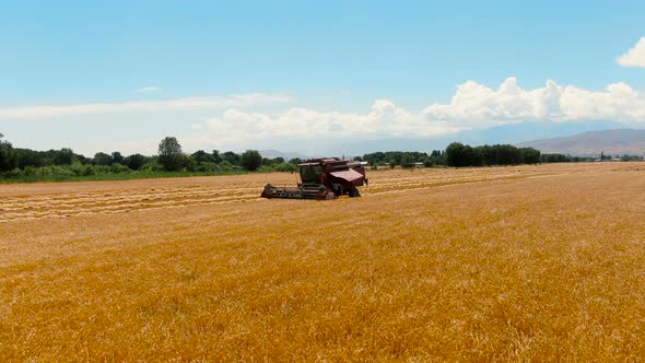 Aerial view of Broken Down Combine Harvester In Agricultural Field alt