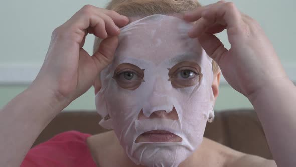 Portrait of Mature Woman in Facial Mask for Face alt