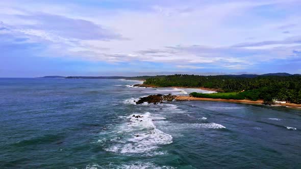 Aerial footage over blue ocean in srilanka