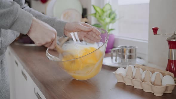 Male Mixes the Ingredients for Pancakes