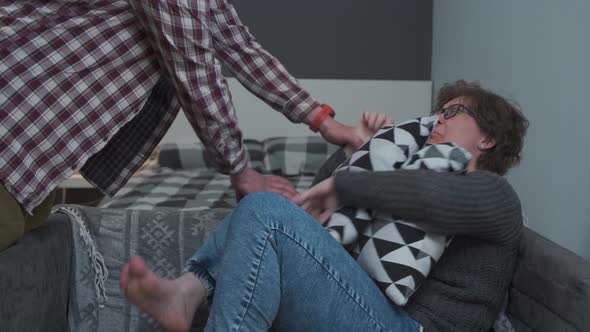 Woman is Trying to Protect Herself From Physical Abuse of Man at Home alt