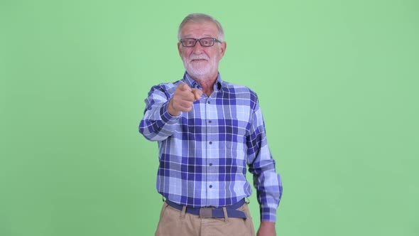 Happy Senior Bearded Hipster Man Pointing at Camera alt