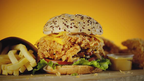 Crispy Chicken Burger with Cheddar Cheese Lettuce Tomato Onion alt