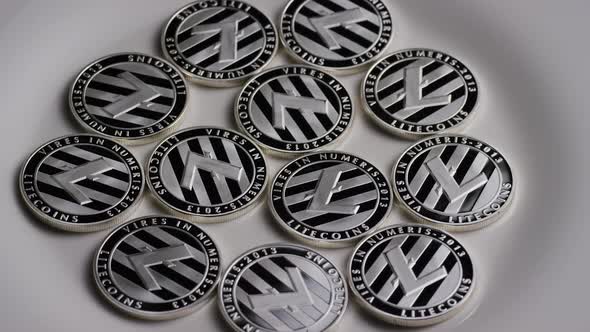 Rotating shot of Litecoin Bitcoins (digital cryptocurrency) - BITCOIN LITECOIN 0093 alt