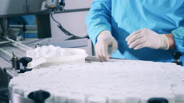 Pill Jars are Getting Sealed and Relocated By Factory Employees alt