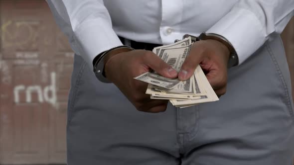 Close Up Businessman Arrested for Bribe alt