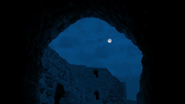 Moon Above Ancient Building Through Arch alt