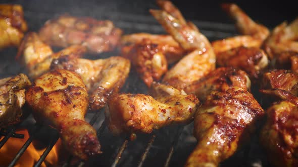 Delicious Chicken Pieces Frying on Barbecue Grill alt
