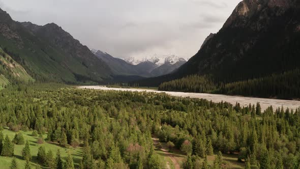 River and mountains with white clouds alt