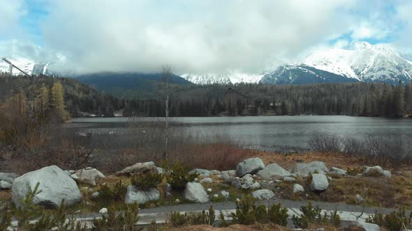 Aerial View of Strbske Pleso in the Clouds and Snowy Mountains. Slovakia alt