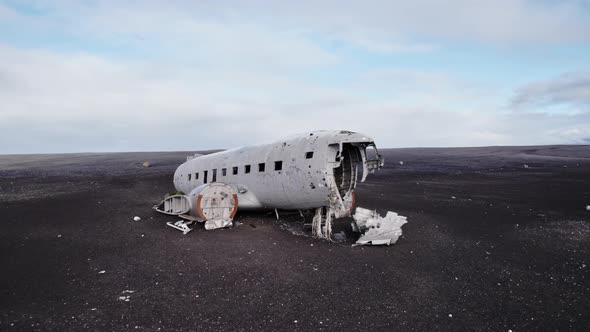 Aerial Shot of Solheimasandur Plane Wreck Vast Rocky Field Sky in Background alt