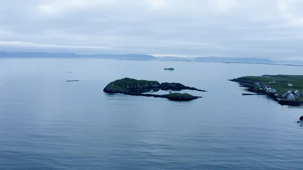 Panoramic View Over Serene Seascape With Boats Dock Near Flatey Island Shoreline In Iceland. Aerial alt