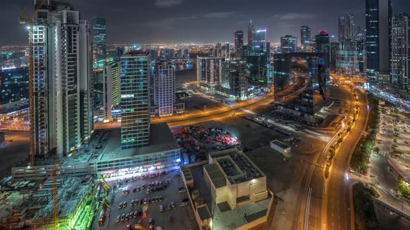 Dubai's Business Bay Towers Aerial Night Timelapse alt