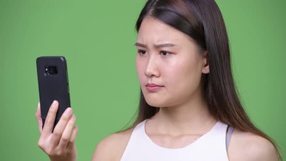 Young Beautiful Asian Businesswoman Using Phone