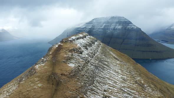 Flying Towards the Island of Kalsoy Over the Klakkur Mountain on Faroe Islands alt