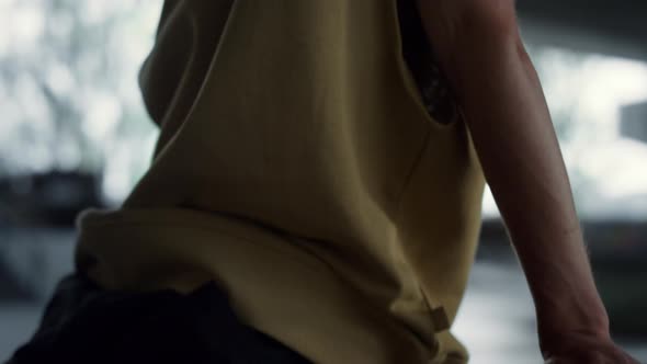 Young Man Resting with Skate Board at Skate Park alt