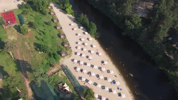 Aerial Top View of River Sand Beach with Lounges and Umbrellas alt