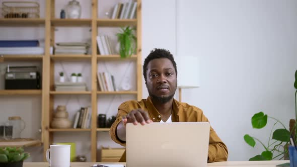 Businessman Working with Computer Remotely and Sitting at Table in Home Office Spbas alt
