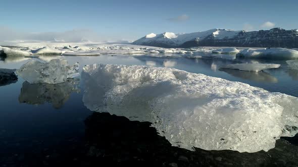 Flying Above Floating Icebergs. Ice From Glacier Crystal Shining. Ice Lagoon Global Warming Explore alt