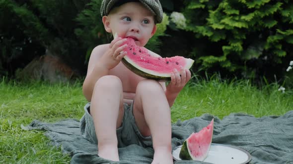 Little Boy Eating Slice of Watermelon Outdoors alt